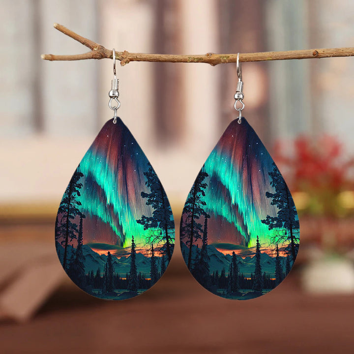 Teardrop-shaped dangling earrings with dawn forest scene print, bohemian and minimalist style, leather accessory